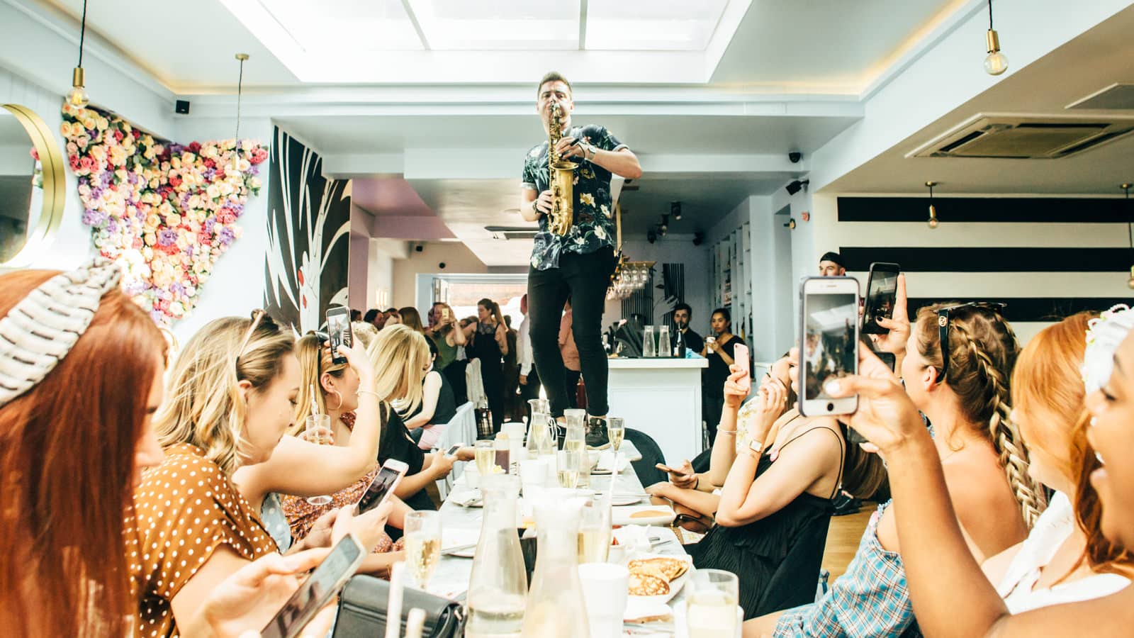 Mobile DJ & saxophonist on table