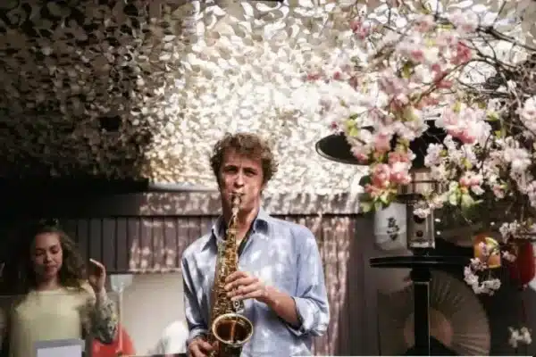 Flower background saxophonist