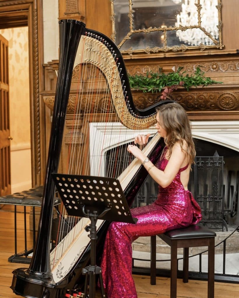 performing harpist at wedding pink dress